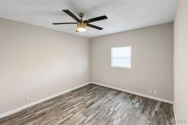 208 Washington Ave, East Alton, IL 62024 - unfurnished room with wood finished floors, a textured ceiling, and a ceiling fan