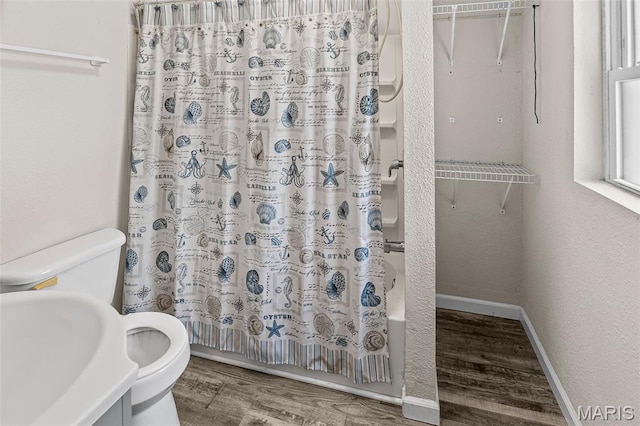 208 Washington Ave, East Alton, IL 62024 - full bathroom featuring wood finished floors and shower / bathtub combination with curtain