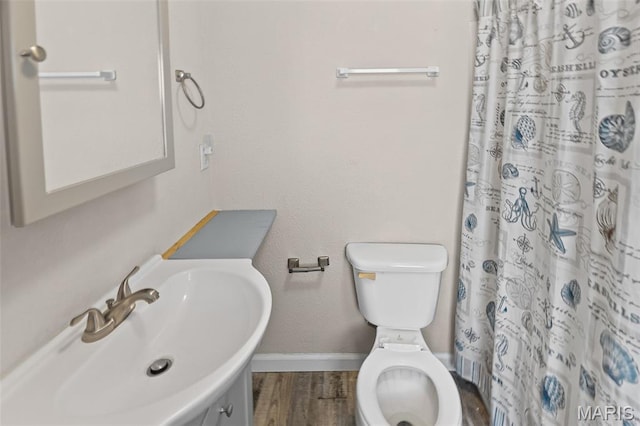 208 Washington Ave, East Alton, IL 62024 - full bath with wood finished floors and curtained shower