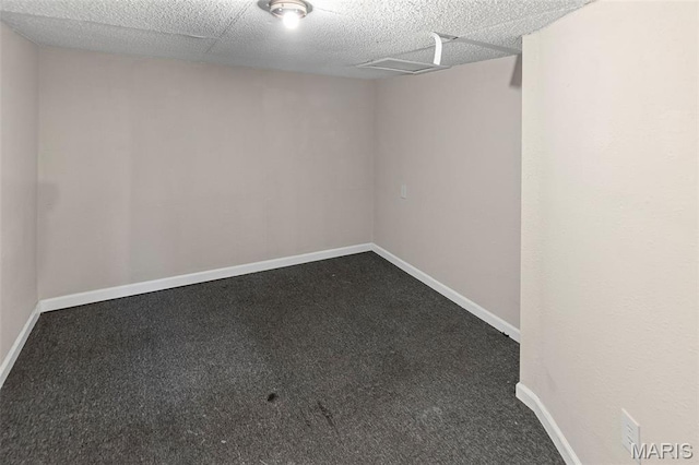 208 Washington Ave, East Alton, IL 62024 - finished below grade area with dark carpet and baseboards
