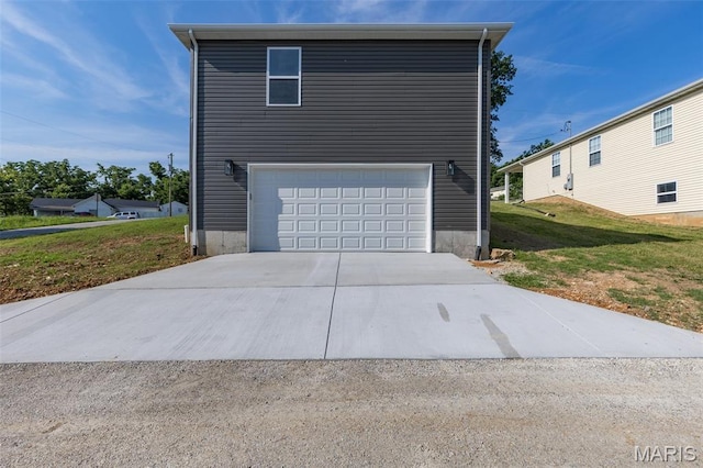 600 Allen Place, De Soto, MO 63020 - view of side of property featuring concrete driveway, a garage, and a yard