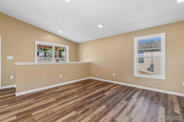 600 Allen Place, De Soto, MO 63020 - empty room with wood finished floors, recessed lighting, and vaulted ceiling