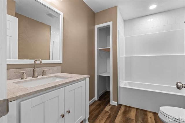600 Allen Place, De Soto, MO 63020 - bathroom with vanity, wood finished floors, bathing tub / shower combination, and recessed lighting