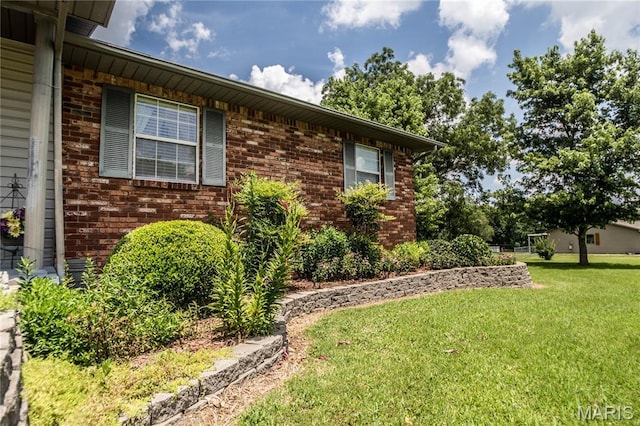 5707 Cedar Rdg, Poplar Bluff, MO 63901 - view of home's exterior with brick siding and a lawn