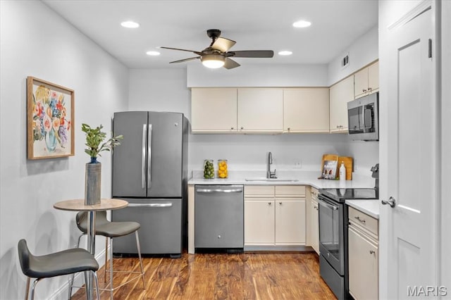 149 Jubilee Hill Dr Unit A, Wildwood, MO 63040 - kitchen with stainless steel appliances, light countertops, a ceiling fan, wood finished floors, and recessed lighting