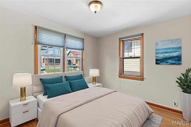 6312 Bradley Ave, Saint Louis, MO 63139 - bedroom featuring wood finished floors and baseboards