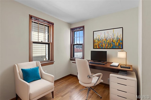 6312 Bradley Ave, Saint Louis, MO 63139 - office with light wood-style flooring and healthy amount of natural light