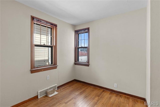 6312 Bradley Ave, Saint Louis, MO 63139 - unfurnished room with plenty of natural light and wood finished floors