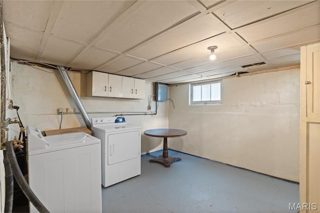 6312 Bradley Ave, Saint Louis, MO 63139 - laundry room featuring separate washer and dryer, cabinet space, and electric panel