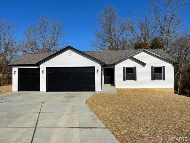 906 Gimli Ln, Wright City, MO 63390 - ranch-style house with a garage and concrete driveway