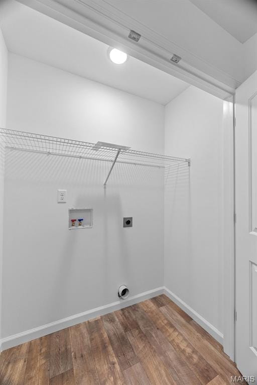 906 Gimli Ln, Wright City, MO 63390 - laundry area featuring electric dryer hookup, washer hookup, and wood finished floors