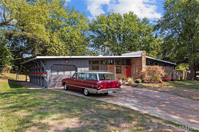 1562 Starlight Dr, Saint Louis, MO 63135 - view of front of home featuring a garage, board and batten siding, and concrete driveway