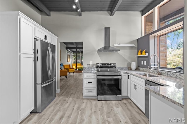 1562 Starlight Dr, Saint Louis, MO 63135 - kitchen featuring stainless steel appliances, wall chimney range hood, open shelves, white cabinetry, and light stone counters