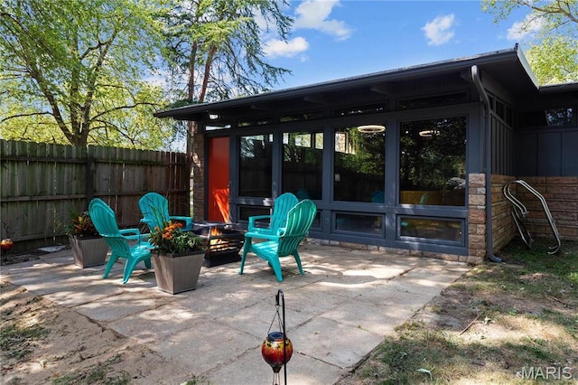 1562 Starlight Dr, Saint Louis, MO 63135 - view of patio with a fire pit