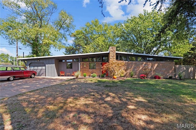 1562 Starlight Dr, Saint Louis, MO 63135 - mid-century modern home featuring an attached garage, board and batten siding, and driveway
