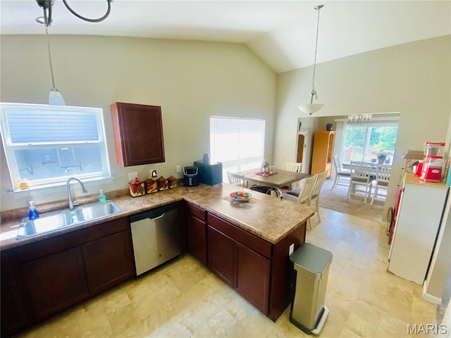 145 Champions Ln, Wentzville, MO 63385 - kitchen featuring dishwasher, high vaulted ceiling, a peninsula, pendant lighting, and light countertops