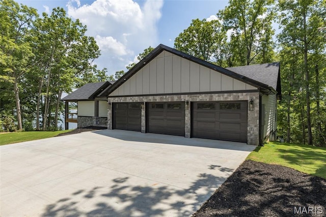 10028 Debbie Pl, Bonne Terre, MO 63628 - view of front of property with stone siding, an attached garage, driveway, roof with shingles, and board and batten siding