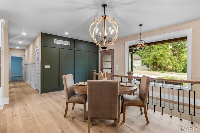 10028 Debbie Pl, Bonne Terre, MO 63628 - dining area featuring a chandelier, light wood-style flooring, a decorative wall, and recessed lighting