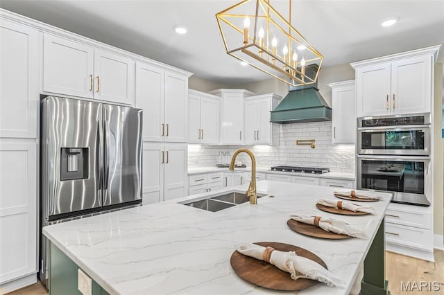 10028 Debbie Pl, Bonne Terre, MO 63628 - kitchen featuring stainless steel appliances, backsplash, white cabinets, an island with sink, and recessed lighting