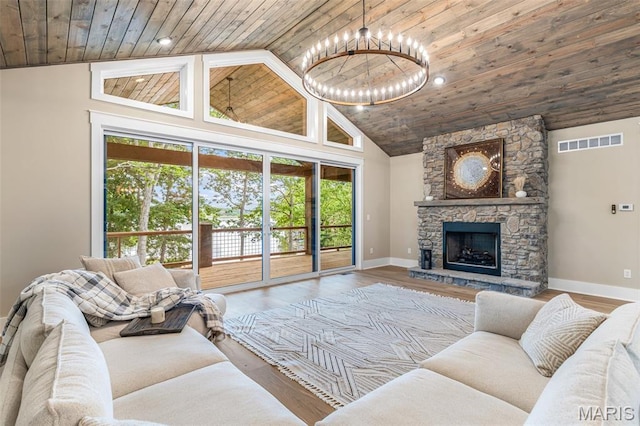 10028 Debbie Pl, Bonne Terre, MO 63628 - living area featuring wooden ceiling, high vaulted ceiling, a chandelier, wood finished floors, and a fireplace