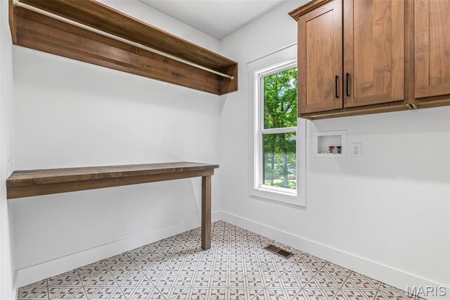 10028 Debbie Pl, Bonne Terre, MO 63628 - laundry area with cabinet space, hookup for a washing machine, and light floors