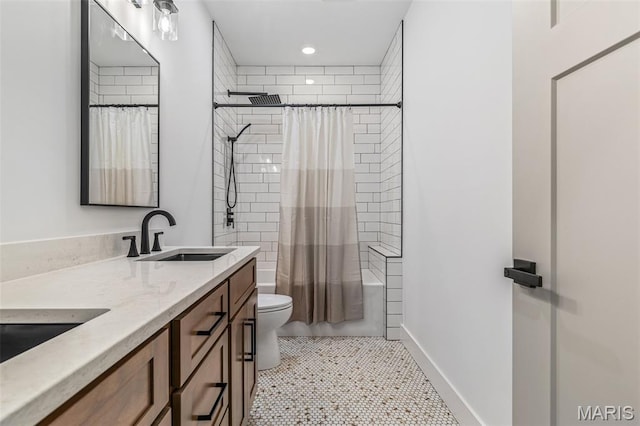 10028 Debbie Pl, Bonne Terre, MO 63628 - full bath featuring double vanity, shower / bath combo, recessed lighting, and tile patterned flooring