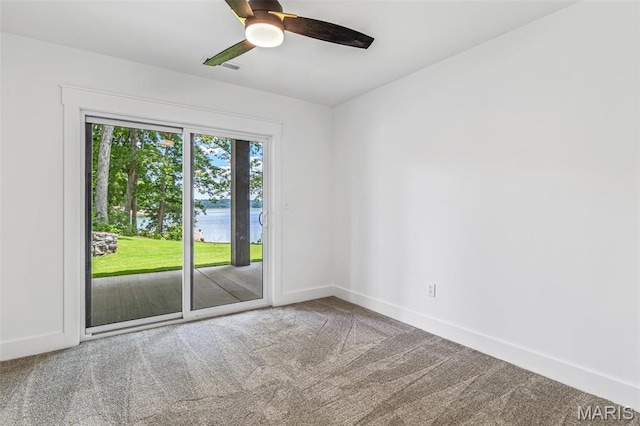 10028 Debbie Pl, Bonne Terre, MO 63628 - carpeted empty room with ceiling fan and a water view