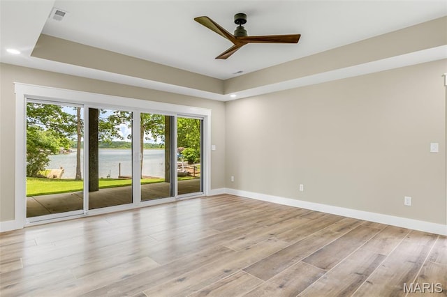 10028 Debbie Pl, Bonne Terre, MO 63628 - spare room featuring a water view, healthy amount of natural light, light wood finished floors, ceiling fan, and recessed lighting
