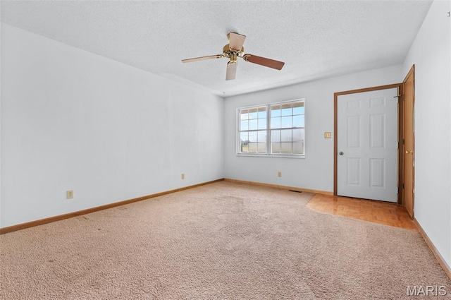 237 Perrottet Dr, Mascoutah, IL 62258 - unfurnished room featuring light carpet, a ceiling fan, and a textured ceiling