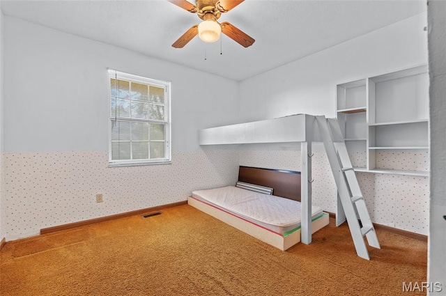 237 Perrottet Dr, Mascoutah, IL 62258 - unfurnished bedroom featuring carpet flooring, wallpapered walls, and a ceiling fan