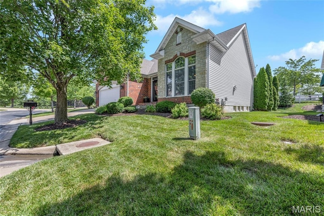 112 Wake Forest Pl, Ofallon, MO 63368 - view of front facade with a front yard, driveway, and brick siding