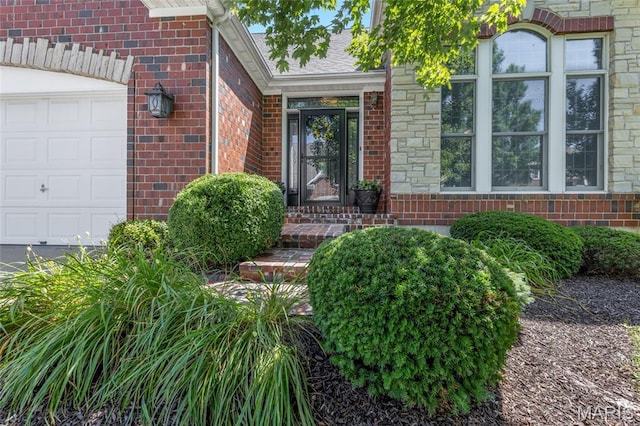 112 Wake Forest Pl, Ofallon, MO 63368 - property entrance with brick siding and a garage