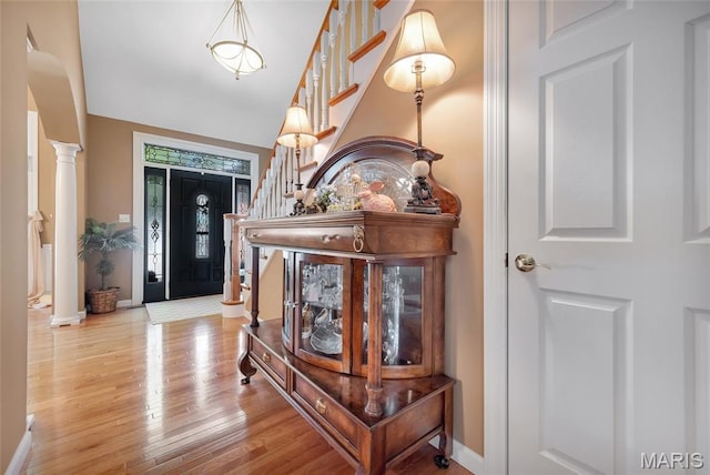 112 Wake Forest Pl, Ofallon, MO 63368 - foyer with stairs, ornate columns, and wood finished floors