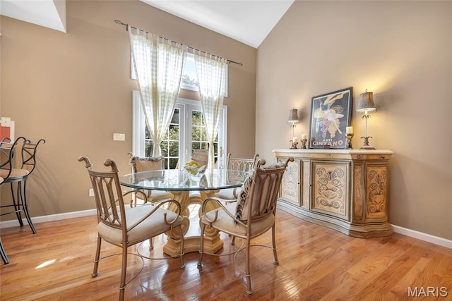 112 Wake Forest Pl, Ofallon, MO 63368 - dining space featuring high vaulted ceiling and light wood-style flooring