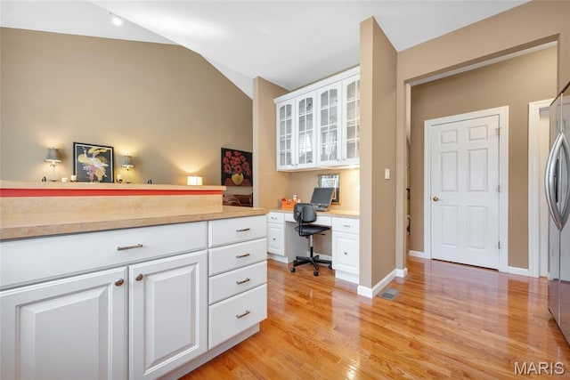 112 Wake Forest Pl, Ofallon, MO 63368 - office area with light wood-style flooring, built in desk, and lofted ceiling