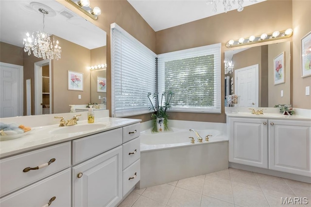 112 Wake Forest Pl, Ofallon, MO 63368 - full bathroom featuring two vanities, a garden tub, tile patterned floors, and a chandelier