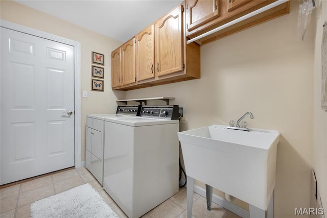 112 Wake Forest Pl, Ofallon, MO 63368 - laundry area with cabinet space, washing machine and clothes dryer, and light tile patterned flooring