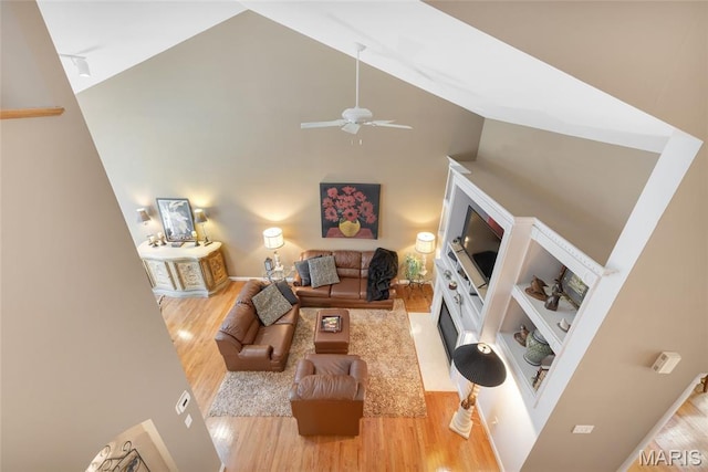 112 Wake Forest Pl, Ofallon, MO 63368 - living room with high vaulted ceiling, wood finished floors, and a ceiling fan