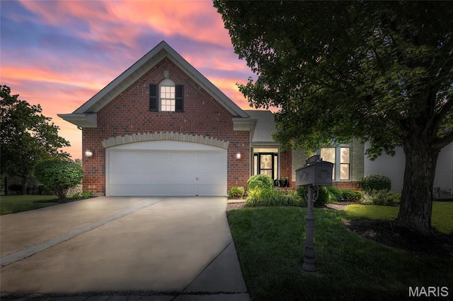 112 Wake Forest Pl, Ofallon, MO 63368 - traditional home featuring brick siding, concrete driveway, and a yard