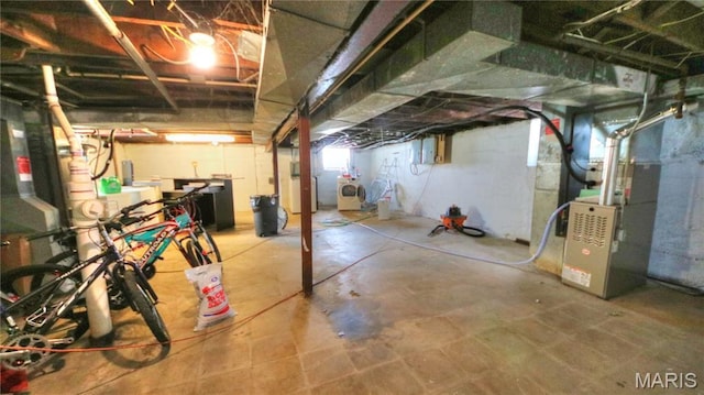 5912 Arsenal St, Saint Louis, MO 63139 - basement with washer / clothes dryer and heating unit