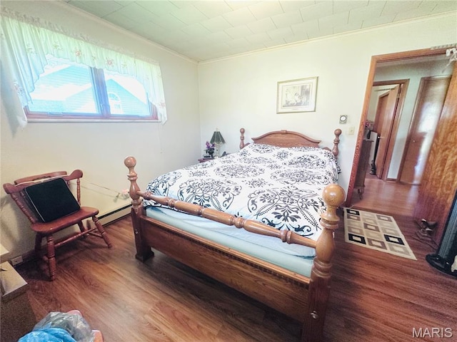 1620 N Jefferson St, Mexico, MO 65265 - bedroom featuring crown molding, wood finished floors, and a baseboard radiator