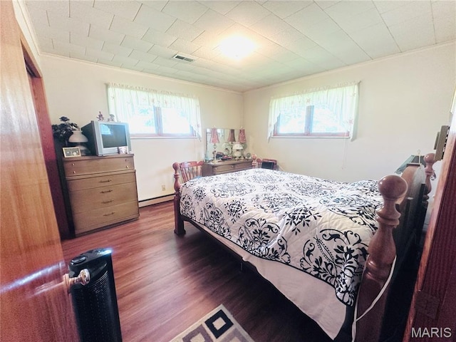 1620 N Jefferson St, Mexico, MO 65265 - bedroom featuring crown molding, wood finished floors, and a baseboard radiator