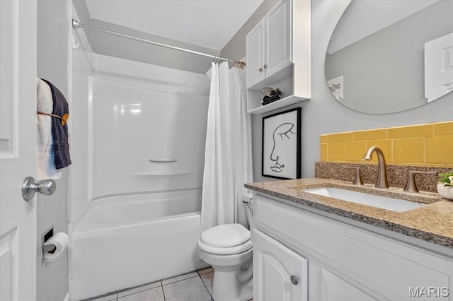 117 1st Ave, Edwardsville, IL 62025 - full bathroom featuring vanity, tile patterned flooring, shower / bath combo, and decorative backsplash