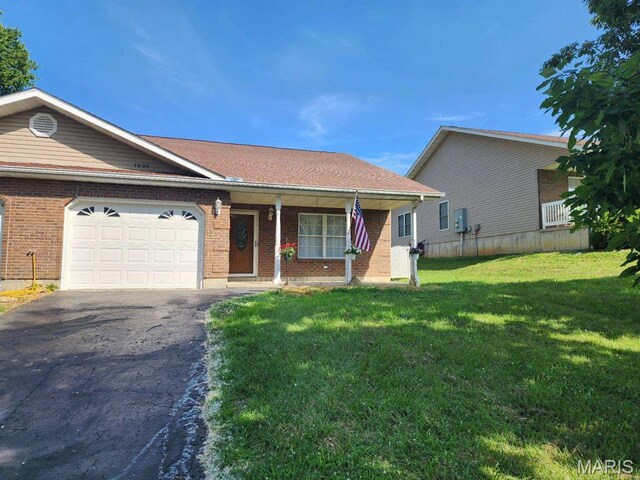 1604 Napoleon Dr, Bonne Terre, MO 63628 - ranch-style home with an attached garage, asphalt driveway, a front lawn, covered porch, and brick siding