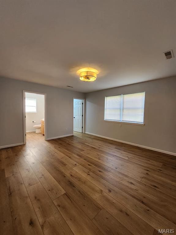 1604 Napoleon Dr, Bonne Terre, MO 63628 - empty room with hardwood / wood-style flooring and healthy amount of natural light