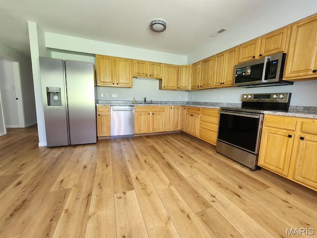1604 Napoleon Dr, Bonne Terre, MO 63628 - kitchen featuring appliances with stainless steel finishes, light wood-style flooring, and light brown cabinetry
