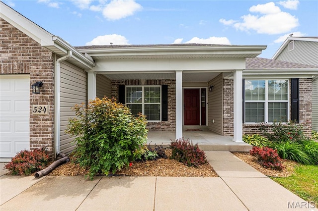 524 Pleasant Breeze Dr, Wentzville, MO 63385 - doorway to property with brick siding, a porch, an attached garage, and roof with shingles