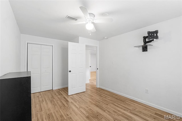 524 Pleasant Breeze Dr, Wentzville, MO 63385 - unfurnished bedroom featuring light wood-style floors, a closet, and a ceiling fan