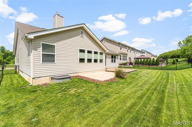 524 Pleasant Breeze Dr, Wentzville, MO 63385 - rear view of property featuring a gazebo, a patio, a fenced backyard, and a chimney