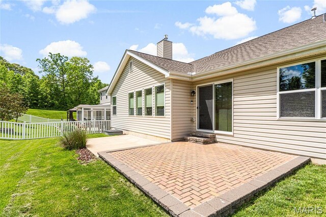 524 Pleasant Breeze Dr, Wentzville, MO 63385 - rear view of house with a patio area and a chimney
